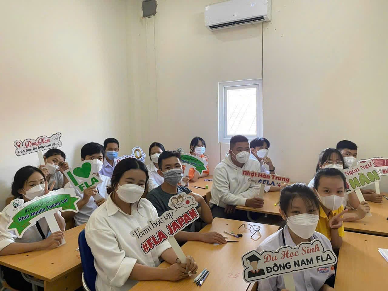 Students in class with language-pathway signs